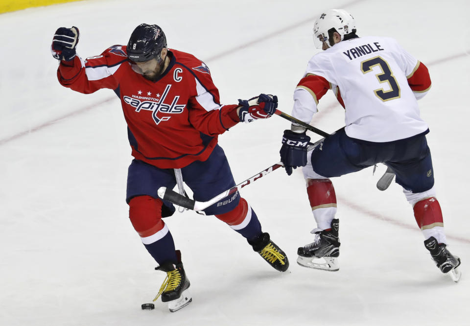 Washington Capitals left wing Alex Ovechkin (8) is unable to swing his stick as it is pinned between the arm of Florida Panthers defenseman Keith Yandle (3) during the third period of an NHL hockey game in Washington, Sunday, April 9, 2017. The Panthers won 2-0. (AP Photo/Manuel Balce Ceneta)