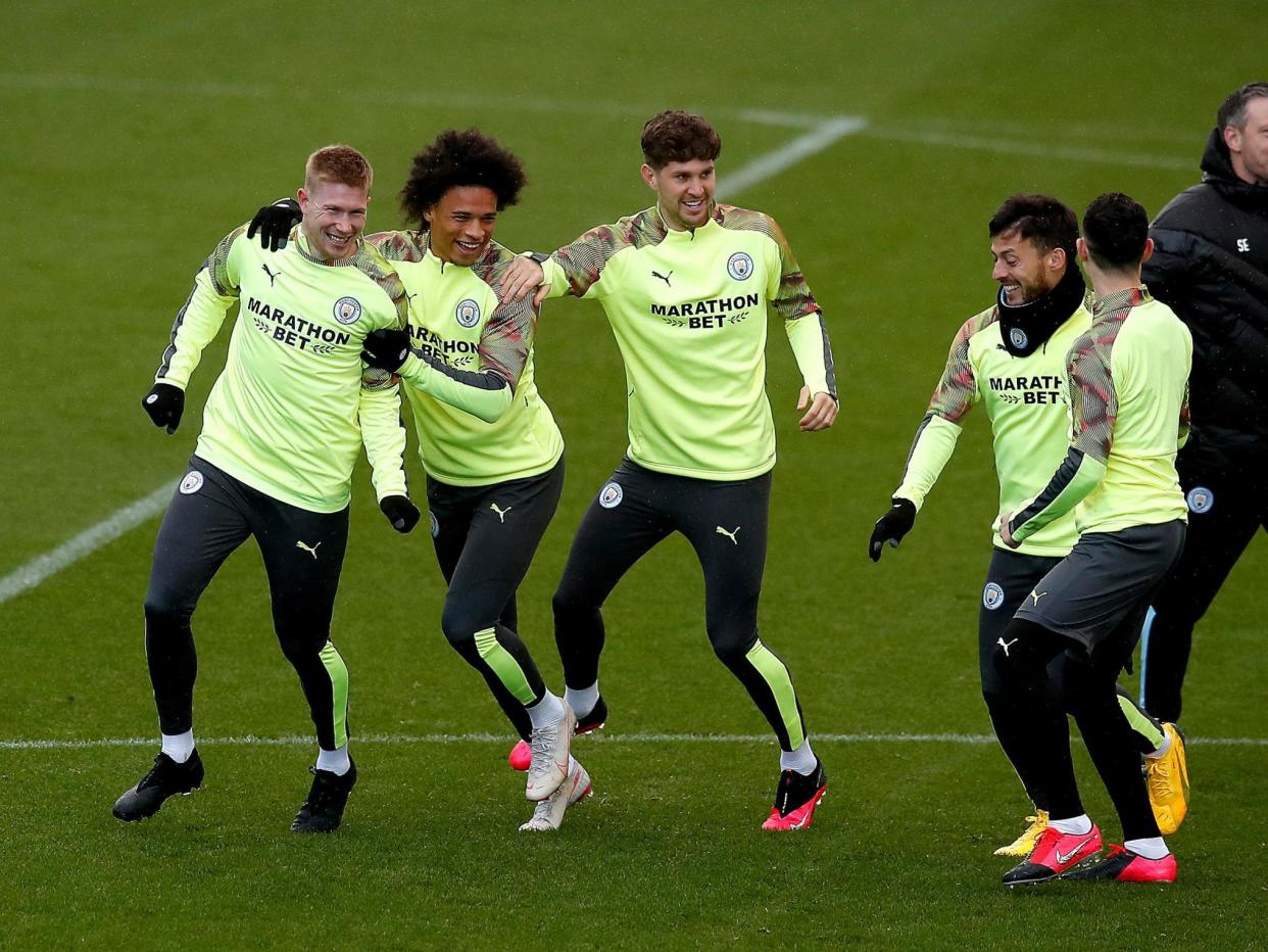 Manchester City's Kevin De Bruyne (left), Leroy Sane (second left) and John Stones (centre) during the training session: PA