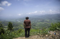 Friar Leopoldo Serrano surveys the landscape where he built a rehab center for drug addicts, in Mission San Francisco de Asis, Honduras, Tuesday, July 15, 2021. As Serrano stood on the lookout over the valley, he said, “Half of all the land and businesses you see from here belong to drug traffickers." (AP Photo/Rodrigo Abd)