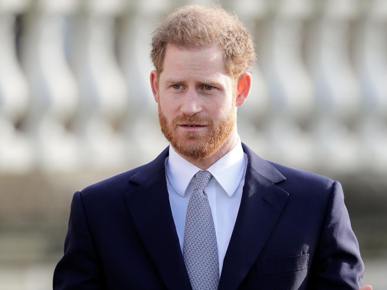 Britain's Prince Harry gestures in the gardens of Buckingham Palace in London, Thursday, Jan. 16, 2020. Prince Harry, the Duke of Sussex will host the Rugby League World Cup 2021 draw at Buckingham Palace, prior to the draw, The Duke met with representatives from all 21 nations taking part in the tournament, as well as watching children from a local school play rugby league in the Buckingham Palace gardens. (AP Photo/Kirsty Wigglesworth)