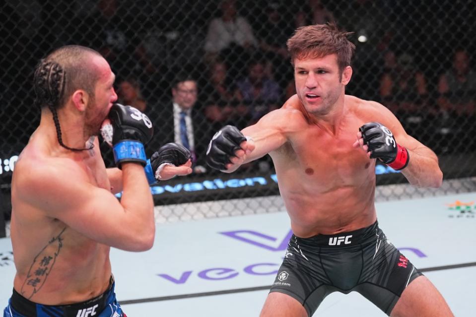 LAS VEGAS, NEVADA – JULY 15: (R-L) Alexander Munoz punches Carl Deaton in their lightweight fight during the UFC Fight Night at UFC APEX on July 15, 2023 in Las Vegas, Nevada. (Photo by Jeff Bottari/Zuffa LLC via Getty Images)