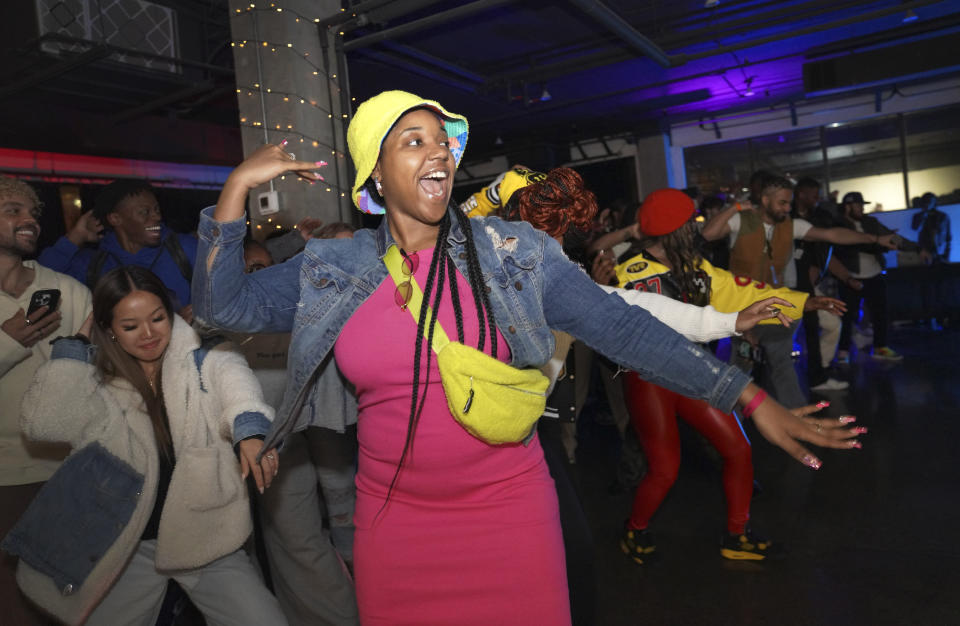 Jade Russell of Louisville, Kentucky, dances at The Cove, a pop-up, 18-and-up Christian nightclub, on Saturday, Feb. 17, 2024, in Nashville, Tenn. The Cove was started last year by seven Black Christian men in their 20s who sought to build a thriving community and a welcoming space for young adults outside houses of worship. (AP Photo/Jessie Wardarski)