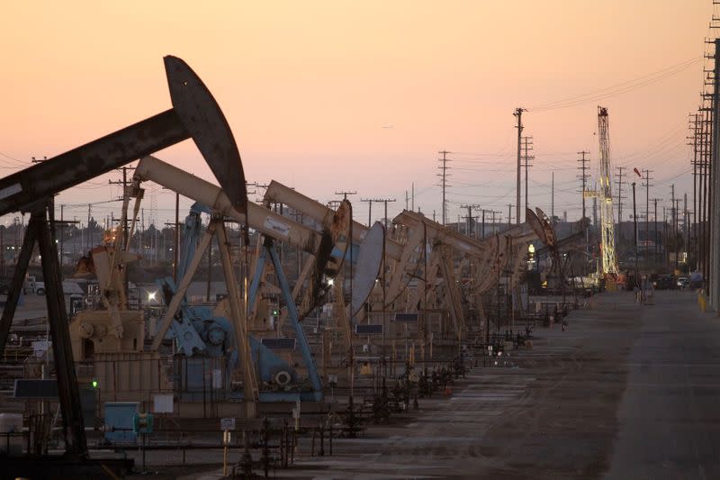 Oil rig pumpjacks extract crude from the Wilmington Field oil deposits area where Tidelands Oil Production Company operates near Long Beach, California