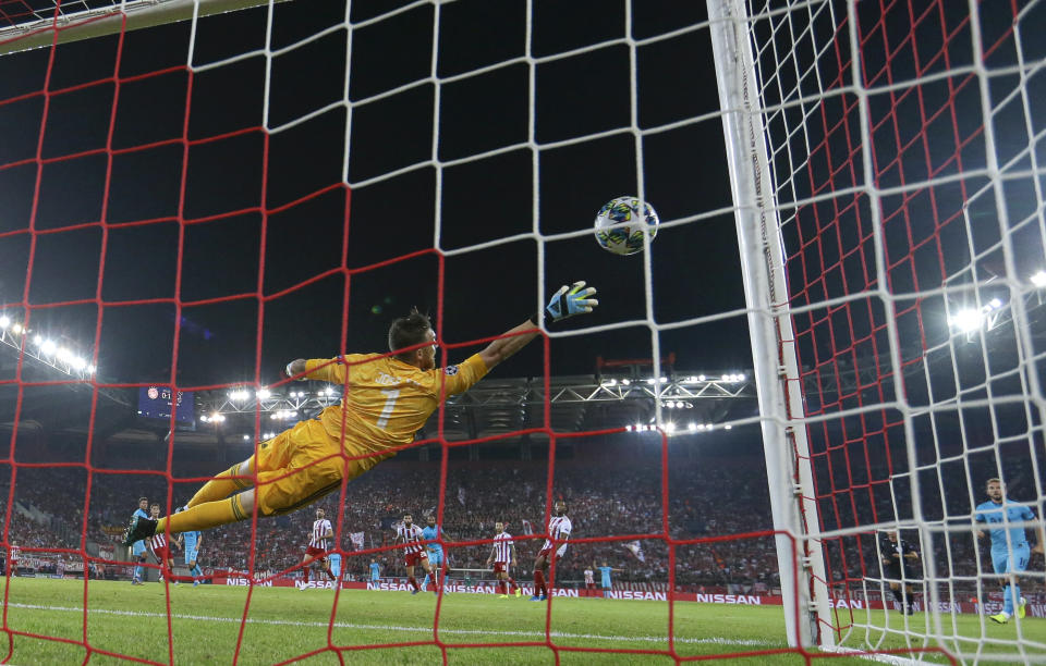 Olympiakos' goalkeeper Jose Sa fails to stop a shot by Tottenham's Lucas Moura during the Champions League group B soccer match between Olympiakos and Tottenham, at the Georgios Karaiskakis stadium, in Piraeus port, near Athens, Wednesday, Sept. 18, 2019. (AP Photo/Thanassis Stavrakis)