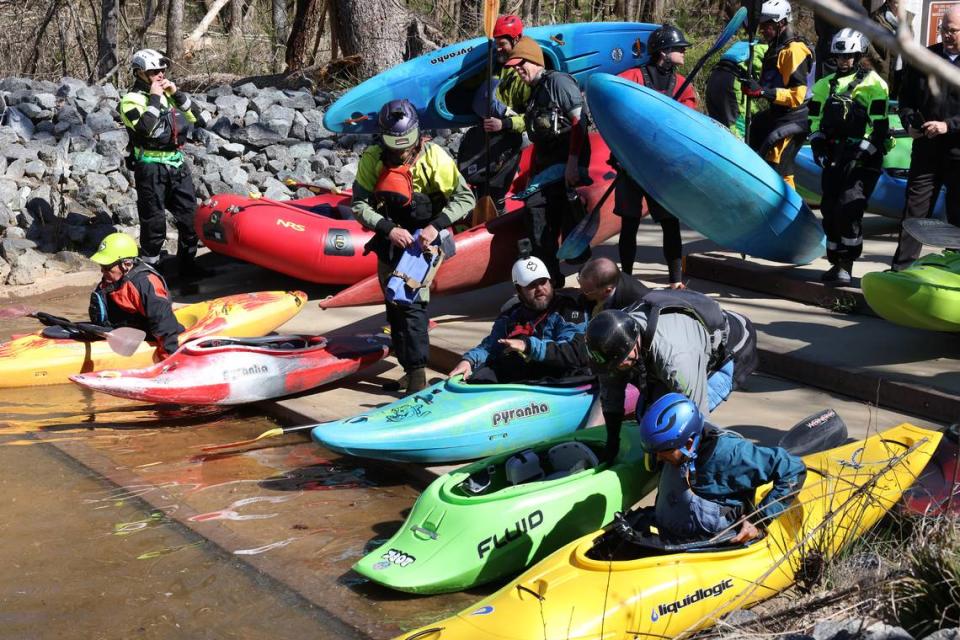 Kayakers line up to enter the Catawba River at the Nitrolee Access Area in Great Falls, S.C. The access area leads paddlers to the long bypass channel that has not seen water in 117 years.