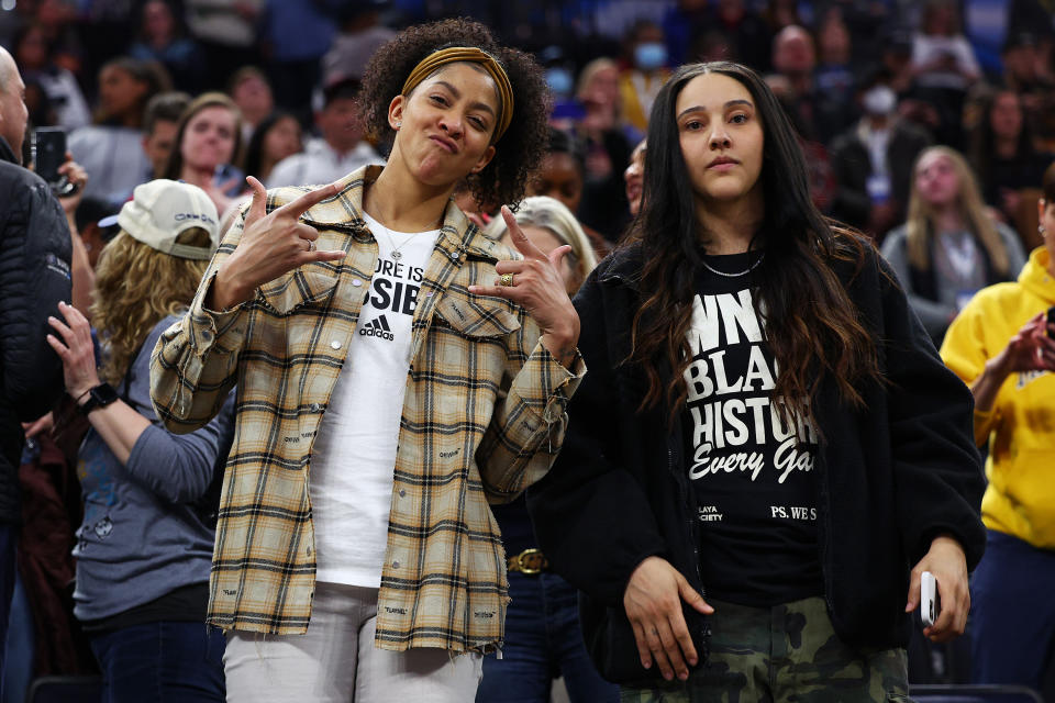 WNBA players Candace Parker and Natalie Achonwa watch the 2022 NCAA women&#39;s championship game in Minneapolis. (Elsa/Getty Images)