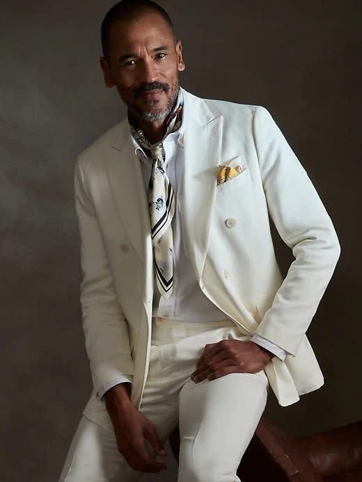 Model wearing a double breasted white Banana Republic suit