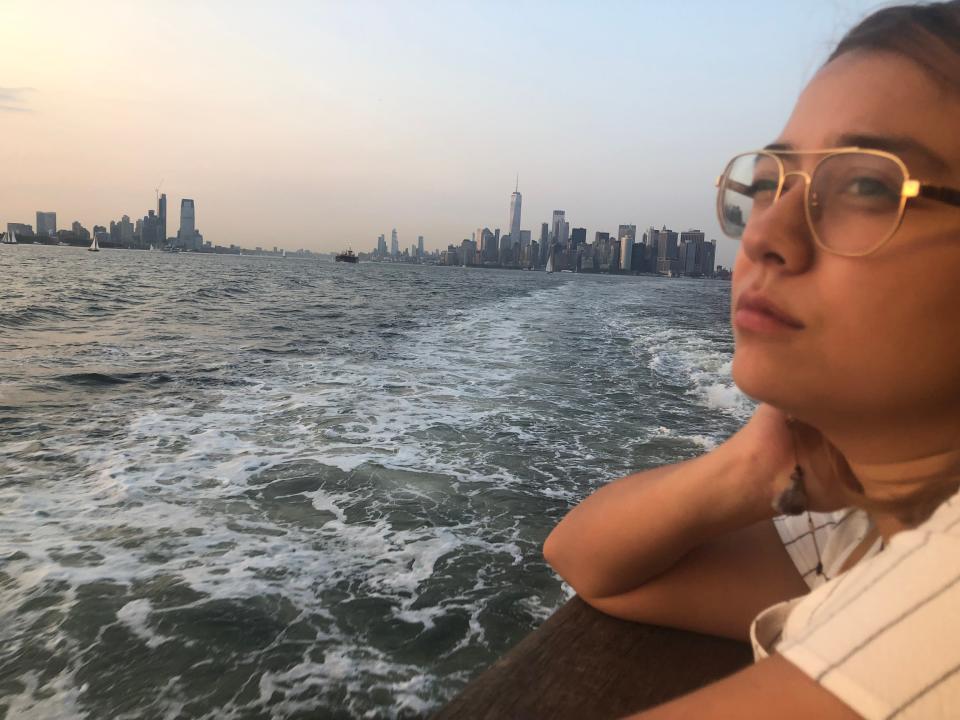 The author on the right looking out at the sea on the left. The Manhattan skyline is behind her.