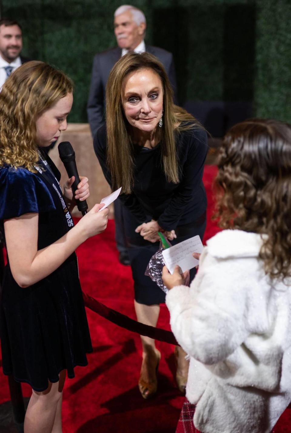 Olympic champion, national spokesperson and commentator Peggy Fleming, part of the 15th class of inductees to the California Hall of Fame, is interviewed by Elk Grove’s Florence Markofer Elementary School student Emma Kingsbury, 10, left, on the red carpet Tuesday, Dec. 13, 2022, before the induction ceremony at the California Museum in downtown Sacramento.