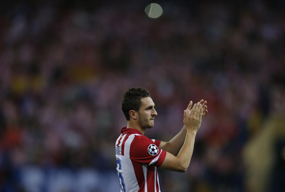 Atletico's Koke applauds to Atletico supporters at the end of the Champions League quarterfinal second leg soccer match between Atletico Madrid and FC Barcelona at the Vicente Calderon stadium in Madrid, Spain, Wednesday, April 9, 2014. (AP Photo/Andres Kudacki)
