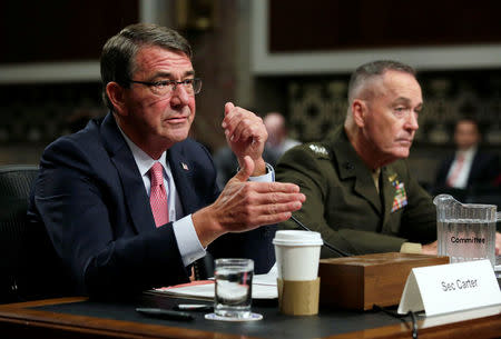 U.S. Defense Secretary Ash Carter (L) and Chairman of the Joint Chiefs of Staff Joseph Dunford testify before a Senate Armed Services Committee hearing on National Security Challenges and Ongoing Military Operations on Capitol Hill in Washington, U.S., September 22, 2016. REUTERS/Yuri Gripas