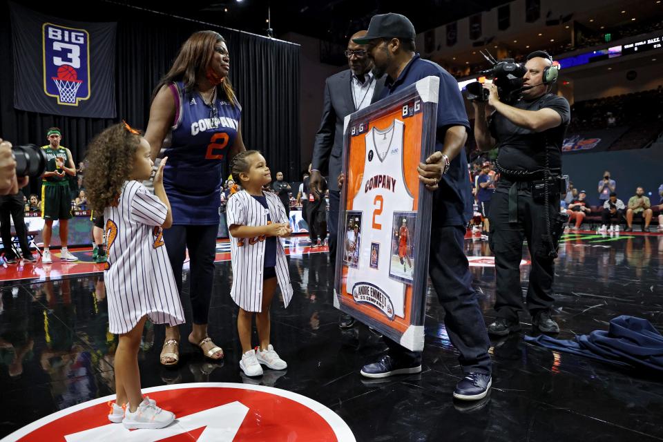 Clyde Drexler and Ice Cube present the Regina Oliver and Andre Emmett's children with a memorial during BIG3 - Week One at the Orleans Arena on July 10, 2021 in Las Vegas.