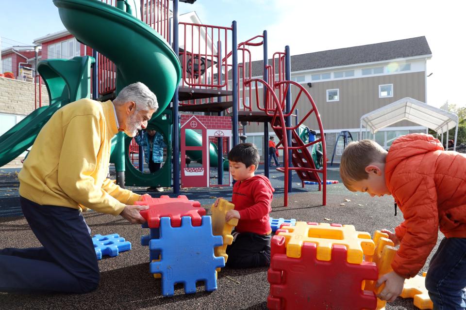Howard Milbert, executive director of the Ossining Children's Center, builds with pre-k students on the playground Nov. 8, 2023. The center is a not-for-profit organization and will have to do more fundraising as federal pandemic funds run out.