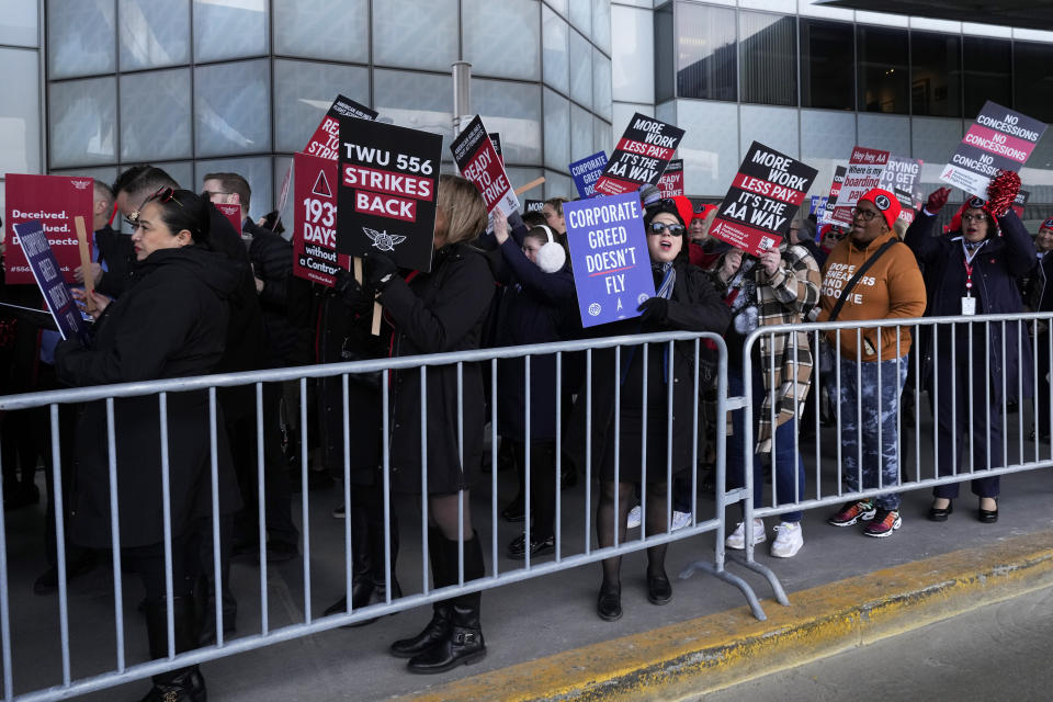 Hundreds of flight attendants protest at O'Hare International Airport in Chicago, Tuesday, Feb. 13, 2024. They represent three different unions and work for several airlines including Southwest, American, and United. Each of the unions are in contract negotiations with the airlines and pushing for fair contracts. (AP Photo/Nam Y. Huh)