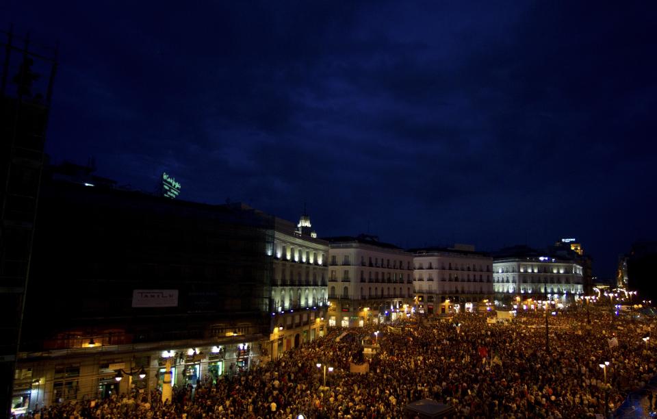 The view from a balcony as protesters pack the Puerta del Sol plaza in central Madrid Saturday May 12, 2012. The protesters returned to Sol to mark the anniversary of the protest movement that inspired groups in other countries. The protests began May 15 last year and drew hundreds and thousands of people calling themselves the indignant movement. The demonstrations spread across Spain and Europe as anti-austerity sentiment grew. (AP Photo/Paul White)