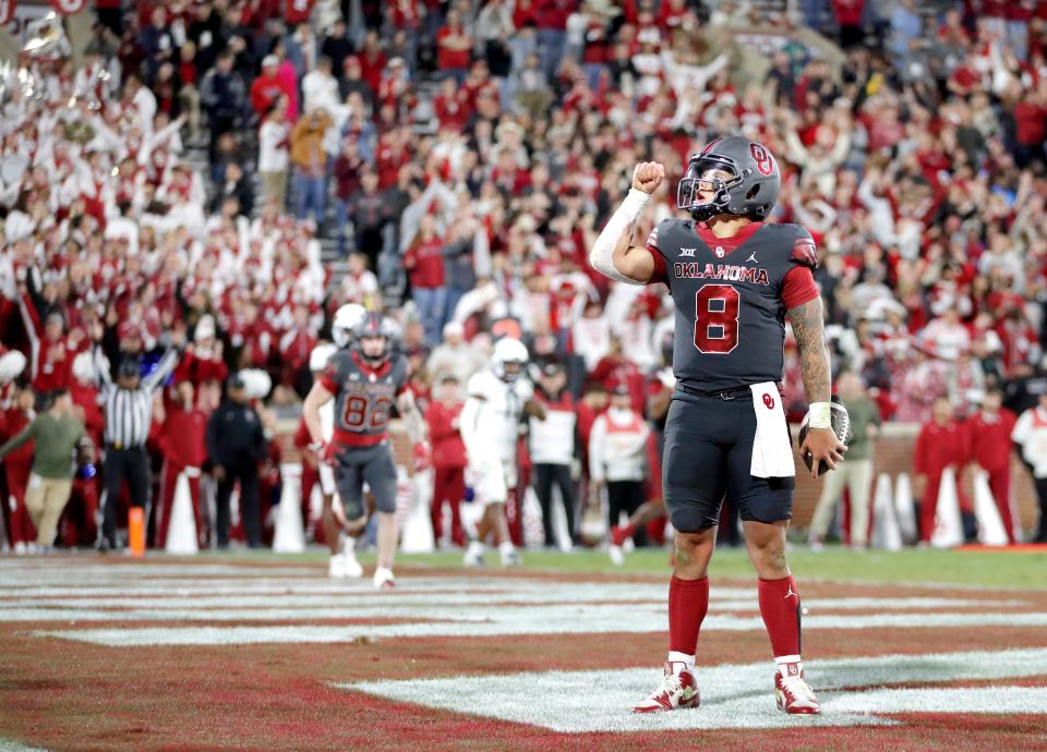 Oklahoma’s Dillon Gabriel (8) reacts after scoring a touchdown in the second half of a college football game between the University of Oklahoma Sooners and the West Virginia Mountaineers at Gaylord Family-Oklahoma Memorial Stadium in Norman, Okla., Saturday, Nov., 11, 2023. SARAH PHIPPS/THE OKLAHOMAN-USA TODAY NETWORK