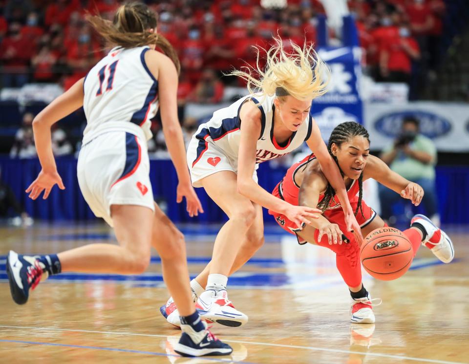 Sacred Heart's Josie Gilvin battles Anderson County's Amiya Jenkins for a loose ball at the Sweet 16 semifinal game at Rupp Arena. April 10, 2021