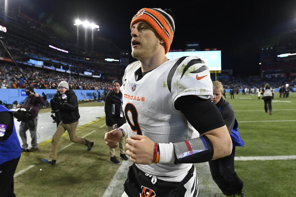 Cincinnati Bengals quarterback Joe Burrow leaves the field after an NFL divisional round playoff football game against the Tennessee Titans, Saturday, Jan. 22, 2022, in Nashville, Tenn. The Cincinnati Bengals won 19-16. (AP Photo/Mark Zaleski)