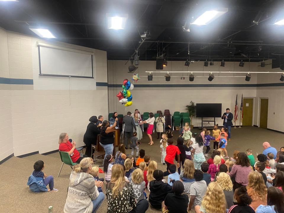 First and second graders at Hall Fletcher dancing to music while celebrating Maggie Allen for winning beginning teacher of the year.