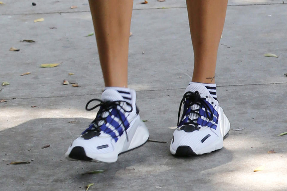 A close-up look at Hailey Baldwin’s Adidas Lxcon sneakers. - Credit: Mega