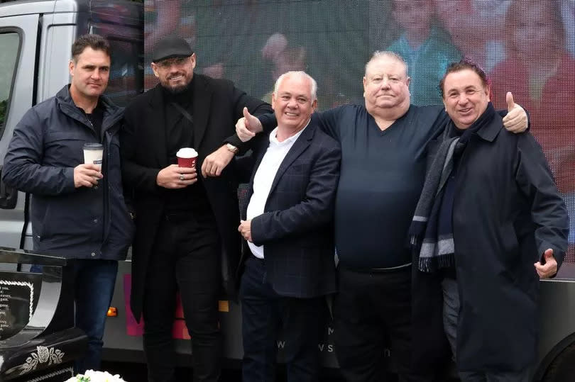 Mourners including Jim's brother Tony Coffey, who is second from the right, and cousin Mike Dooley, who is on the far right, at Western Cemetery in Ely, Cardiff