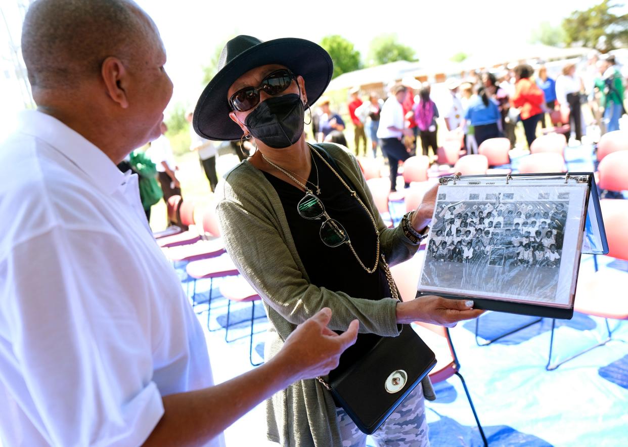 Harley Wortham Jackson, right, shows David Brown a photograph from her 1955 Garden Oaks kindergarten class on Friday at the grand opening of the Garden Oaks Community Center in northeast Oklahoma City.