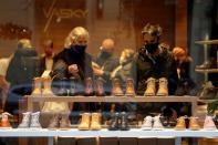 Customers at re-opened shops as restrictions ease in Prague