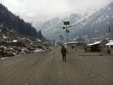 An Afghan security force personnel walks in Parun, capital of Nuristan province, Afghanistan November 22, 2016. REUTERS/Hamid Shalizi