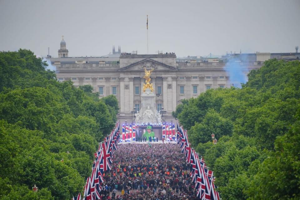 Crowds are seen on The Mall with Queen Elizabeth II shown on a screen during the singing of the National Anthem at the Platinum Jubilee Pageant in front of Buckingham Palace, London, on day four of the Platinum Jubilee celebrations. Picture date: Sunday June 5, 2022. (PA Wire)