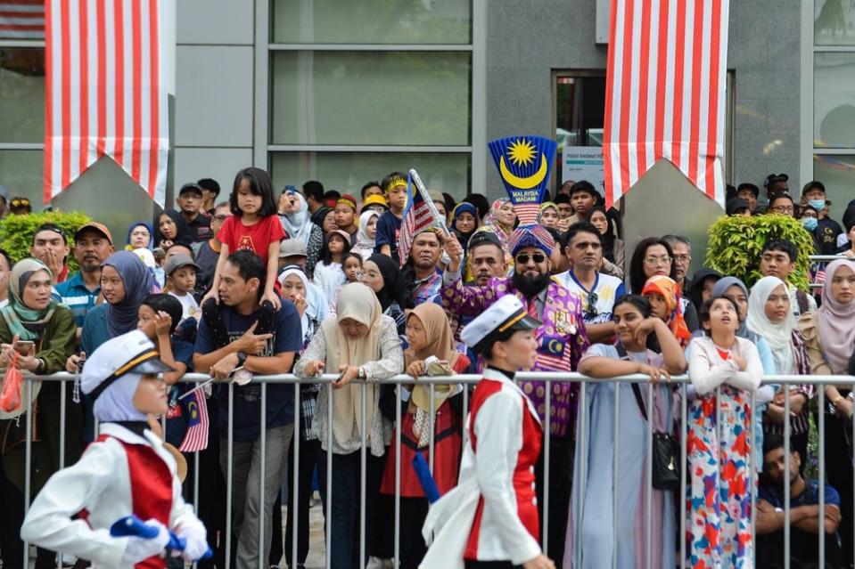 People gather to watch the Merdeka Day parade in Putrajaya August 31, 2023. ― Picture by Miera Zulyana
