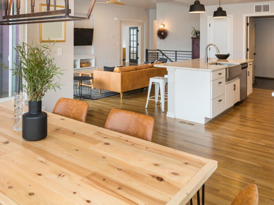 Open-floor kitchen with wooden table