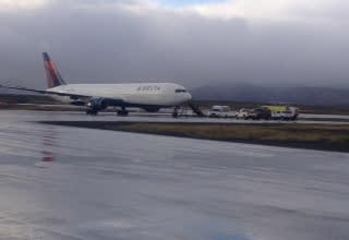 This Oct. 30, 2013, photo provided by the State of Alaska Central Region Department of Transportation & Public Facilities shows a Delta Airlines plane on a runway in Cold Bay, Alaska. A Delta Airlines flight made an emergency landing in a remote Alaska community near the Aleutian Islands Wednesday morning after a warning message flashed on an engine control panel. (AP Photo/State of Alaska Central Region Department, Jeff Doerning)