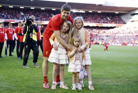 Football - Liverpool v Crystal Palace - Barclays Premier League - Anfield - 16/5/15 Liverpool's Steven Gerrard poses on the pitch with his family after his final game at Anfield. REUTERS/Phil Noble