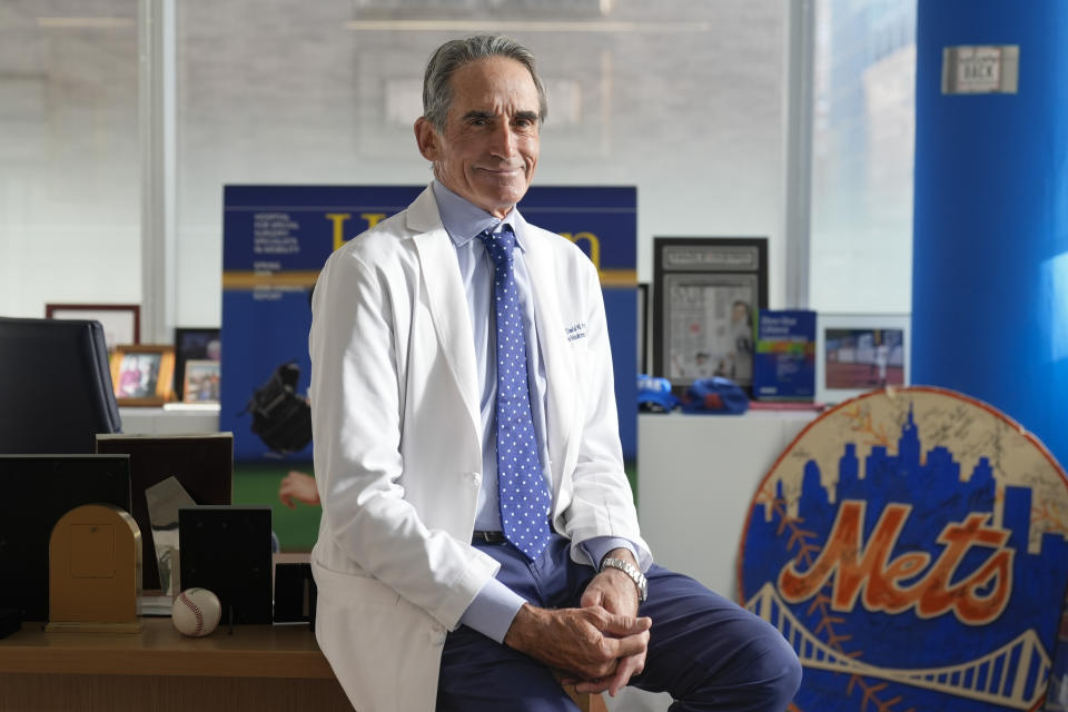 Dr. David Altchek poses in his office in New York, Thursday, Feb. 29, 2024. Zack Wheeler had Tommy John surgery with New York Mets medical director Dr. David Altchek in 2015 and returned two years later. He has gone 69-47 since, becoming a Philadelphia Phillies ace and signing $254 million in contracts. (AP Photo/Seth Wenig)