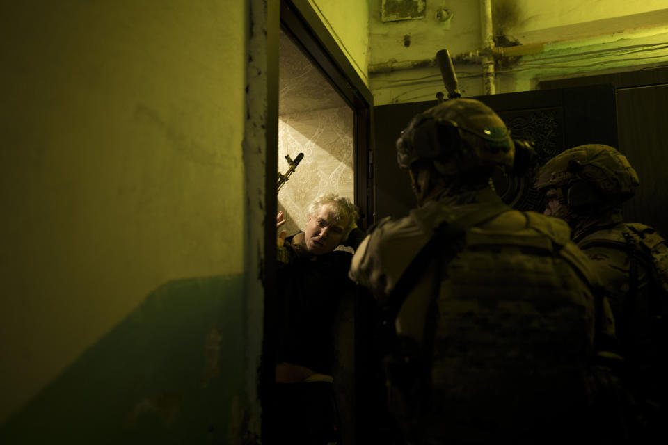 Security Service of Ukraine (SBU) servicemen detain a man suspected to be a Russian collaborator in Kharkiv, Ukraine, Monday, April 18, 2022. Ukrainian authorities are cracking down on anyone suspected of aiding Russian troops under laws enacted by Ukraine’s parliament and signed by President Volodymyr Zelenskyy after the Feb. 24 invasion. Offenders face up to 15 years in prison for acts of collaborating with the invaders or showing public support for them. (AP Photo/Felipe Dana)