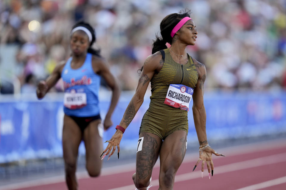 Sha'Carri Richardson wins a heat women's 100-meter run during the U.S. Track and Field Olympic Team Trials Friday, June 21, 2024, in Eugene, Ore. (AP Photo/Charlie Neibergall)