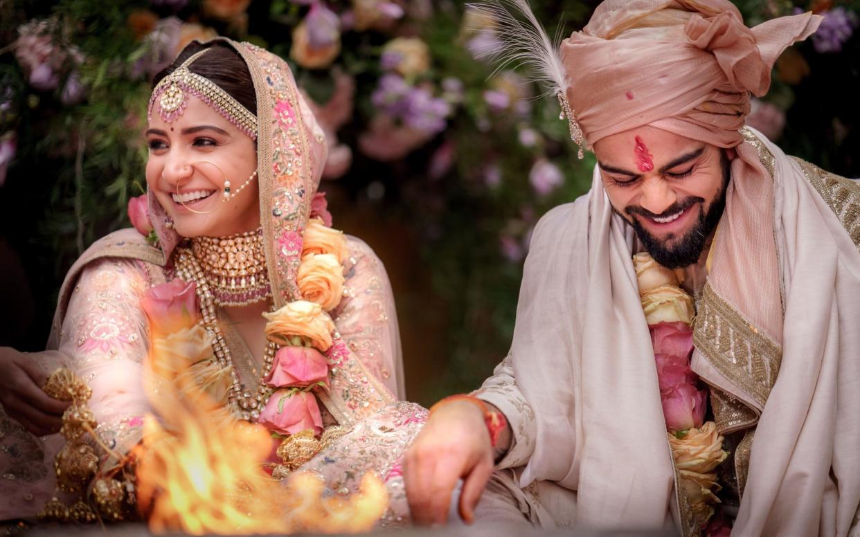 Virat Kohli and Bollywood actress Anushka Sharma at their wedding ceremony in Buoncovento near Siena - AFP