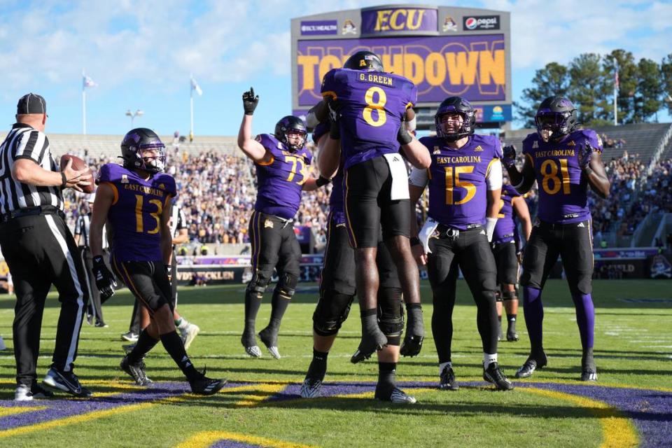 Nov 4, 2023; Greenville, North Carolina, USA; East Carolina Pirates running back Gerald Green (8) celebrates his touchdown run against the Tulane Green Wave during the first half at Dowdy-Ficklen Stadium.