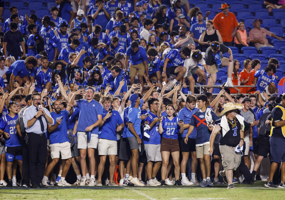 Duke fans prepare to run onto the field to celebrate a victory over Clemson in an NCAA college football game in Durham, N.C., Monday, Sept. 4, 2023. (AP Photo/Ben McKeown)