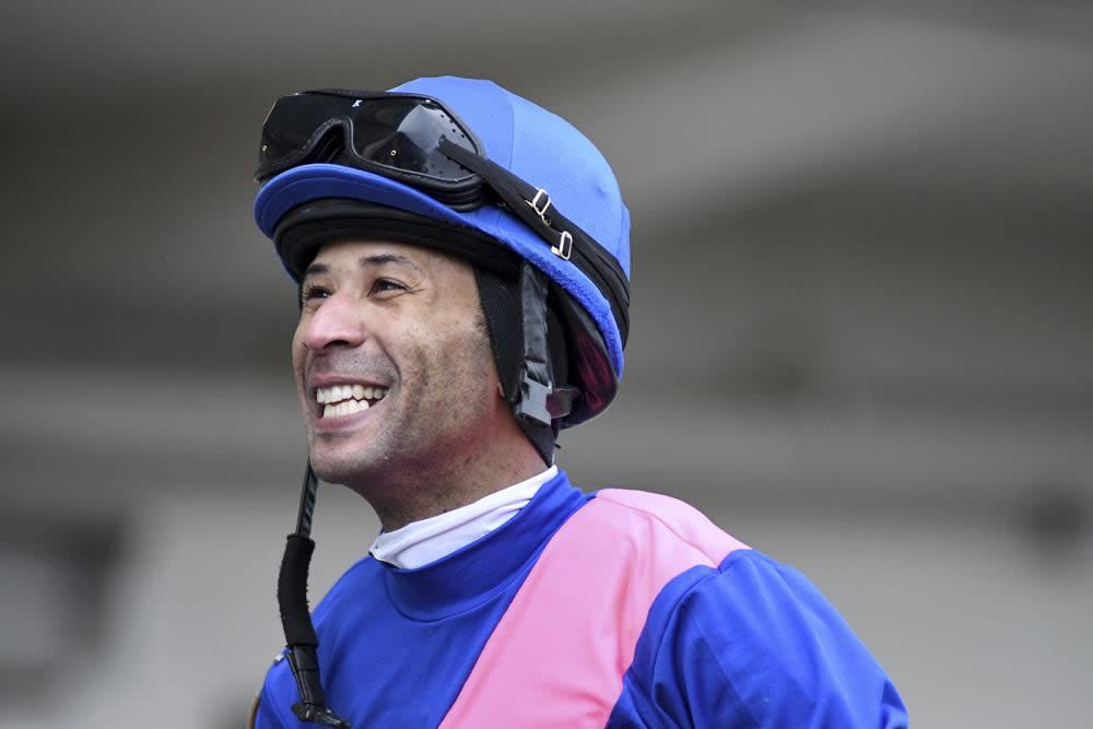 This photo provided by NYRA shows Kendrick Carmouche smiling in the paddock at Aqueduct Racetrack in the Queens borough of New York on Jan. 24, 2020. (NYRA Photos/Coaglianese via AP)