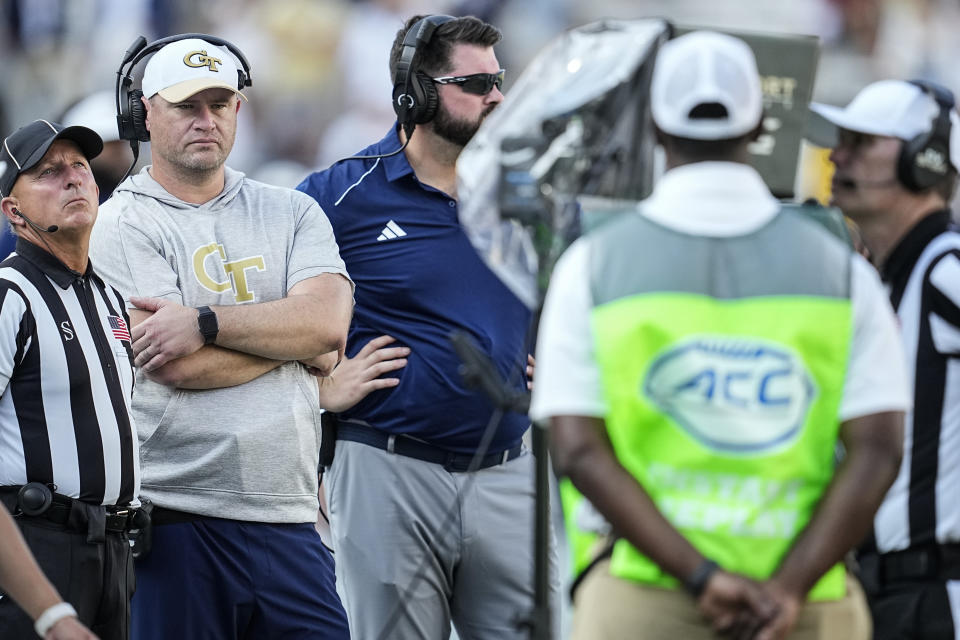 Georgia Tech head coach Brent Key stands with an official during a play review during the second half of an NCAA college football game between Georgia Tech and South Carolina State, Saturday, Sept. 9, 2023, in Atlanta. Georgia Tech won 48-13. (AP Photo/Mike Stewart)