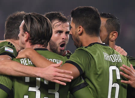 Soccer Football - Serie A - Chievo Verona vs Juventus - Stadio Marc'Antonio Bentegodi, Verona, Italy - January 27, 2018 Juventus’ Sami Khedira celebrates scoring their first goal with Federico Bernardeschi, Miralem Pjanic and team mates REUTERS/Alberto Lingria