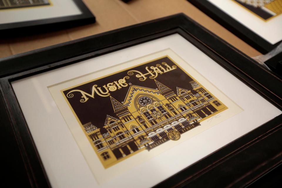 A screen print of Music Hall at Billiter Studio in the Walnut Hills neighborhood of Cincinnati on Wednesday, Nov. 3, 2021. Illustrator James Billiter has made a name for himself with his collection of detailed screen prints of Cincinnati’s iconic architecture. 