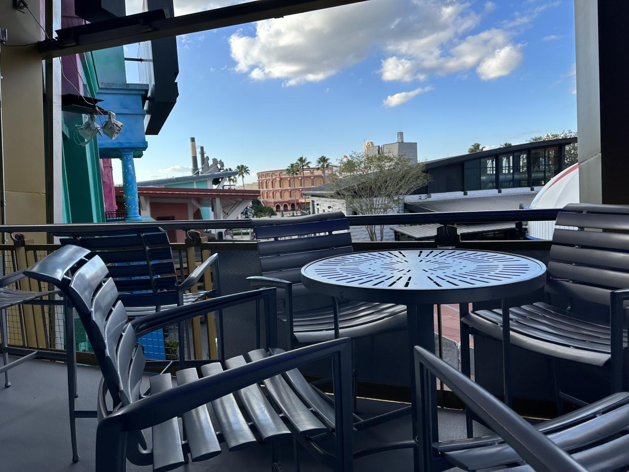The upstairs bar inside Universal's Great Movie Escape features an outdoor balcony seating area with beautiful views of CityWalk and Universal's two theme parks. (Photo: Terri Peters)