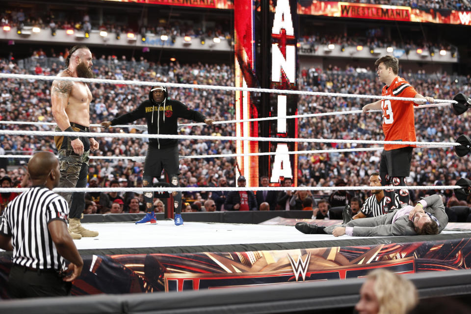 EAST RUTHERFORD, NEW JERSEY - APRIL 07: Braun Strowman battles SNL's Michael Che and Colin Jost at WWE WrestleMania at Met Life Stadium on April 07, 2019 in East Rutherford, New Jersey. (Photo by Brian Ach/Getty Images for WWE)