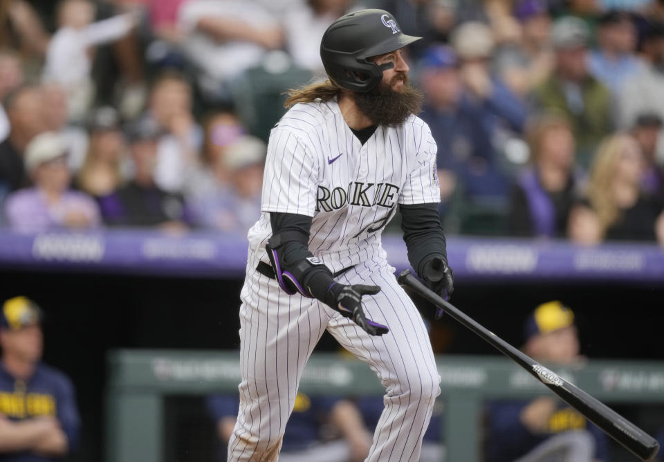 Colorado Rockies' Charlie Blackmon follows the flight of his single to drive in two runs off Milwaukee Brewers starting pitcher Tyson Miller in the eighth inning of a baseball game Thursday, May 4, 2023, in Denver. (AP Photo/David Zalubowski)