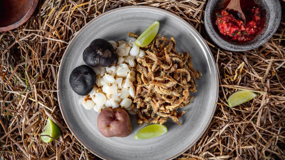 <em>Ispi</em> (small fried fish from Lake Titicaca) is served alongside corn kernels called <em>mote</em>, with <em>chuño</em> (freeze-dried potato) and <em>llajua </em>(Bolivian salsa) at Phayawi in La Paz. - Courtesy Phayawi