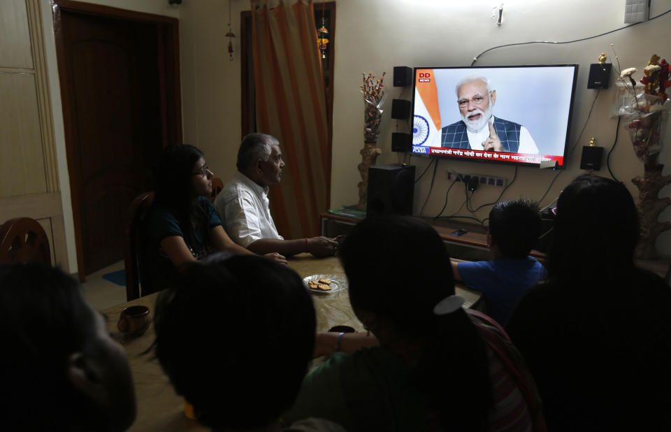 An Indian family watches Indian prime minister Narendra Modi addressing the nation on a television, in Prayagraj, Uttar Pradesh state, India, Wednesday, March 27, 2019. India says it has successfully tested an anti-satellite weapon in an unexpected announcement just weeks before general elections. Indian Prime Minister Narendra Modi said in an address to the nation broadcast live on Wednesday that Indian scientists had earlier shot down a low earth orbit satellite with a missile, demonstrating India’s capacity as a “space power” alongside the U.S., Russia and China. (AP Photo/Rajesh Kumar Singh)