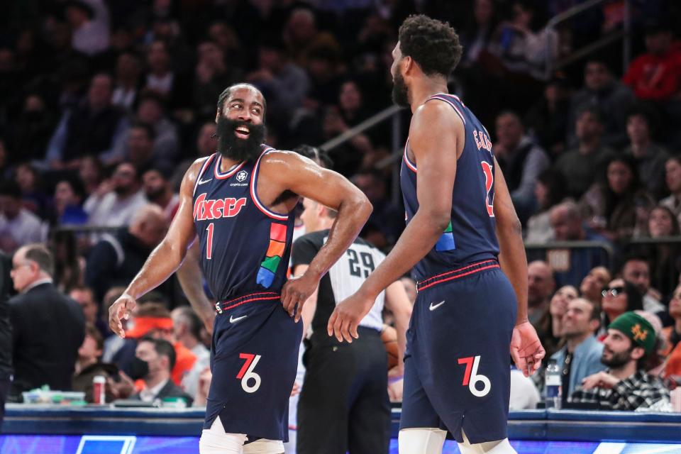 Philadelphia 76ers guard James Harden (1) and center Joel Embiid (21) check back into the game in the second quarter against the New York Knicks.