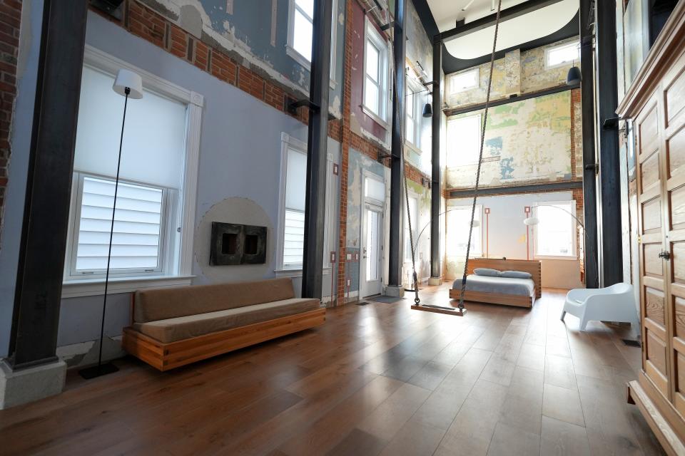 General view of an Airbnb rental property known as the Swing House, featuring a large swing hung from the ceiling, in the industrial neighborhood of Camp Washington in Cincinnati, pictured, Thursday, Dec. 2, 2021. The Italianate, three-story home built in 1880 has been converted into one massive, wide-open room.